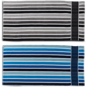 Two cabana towels with horizontal stripes in grey, black, and various shades of blue. Each towel has a logo.