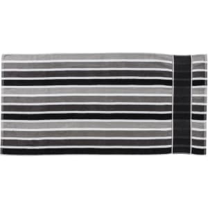 A striped towel featuring shades of grey and black, with a section displaying a logo.