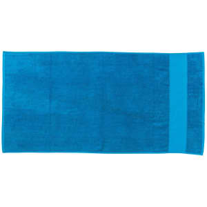 A large, rectangular beach towel in vibrant blue, featuring a solid colour design and a branding logo.