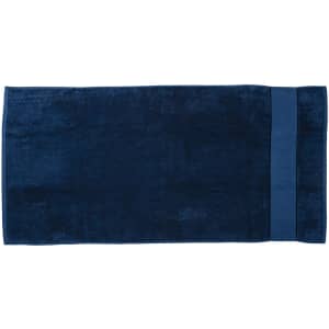 A deep navy blue beach towel featuring a smooth texture and a solid colour design, with a branded logo.