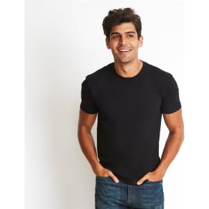 A black men's cotton crew t-shirt displayed on a model, featuring a simple design and tucked hands in pockets.
