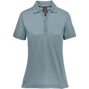 A women's polo shirt in light blue, featuring a classic collar and a small logo on the front.