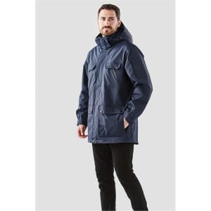 A navy blue men's jacket with multiple pockets and a hood, featuring a logo on the sleeve.
