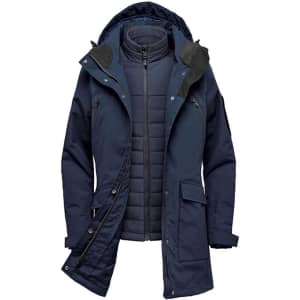A navy blue 5-in-1 system jacket featuring a removable inner layer and an adjustable hood, with a logo on the sleeve.