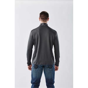 A man in a dark grey long sleeve quarter-zip shirt, viewed from the back, wearing jeans. The shirt features a logo.