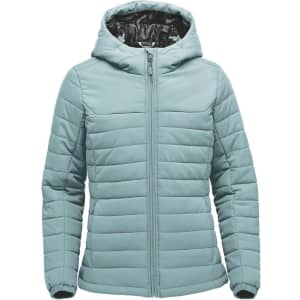 A light teal women's quilted hoody with a zip closure and a hood. The interior has a patterned lining and features a logo.