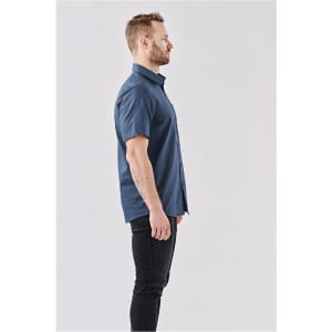 A side view of a men's short-sleeve button-up shirt in navy, featuring a casual fit and a logo.