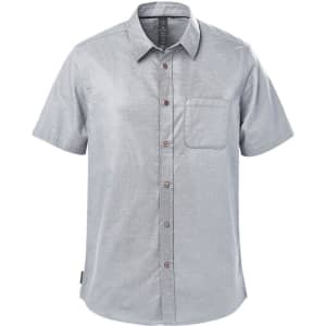 A light grey button-up shirt with short sleeves and a chest pocket. It features a logo on the label.