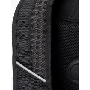 Close-up of a black backpack featuring a textured mesh panel and a circular branding logo.