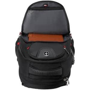 A black backpack with an open top revealing a compartment for a notebook and additional pockets. It features a logo.