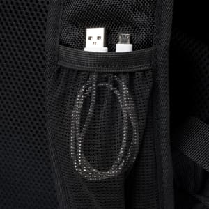 A black backpack featuring a mesh pocket containing USB and micro USB cables. It has a logo.