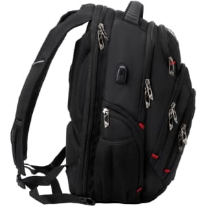 A black backpack with multiple zippers and pockets, featuring padded straps and a logo.