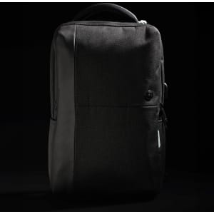 A sleek black backpack with a textured finish and a subtle logo, featuring zippered compartments and a sturdy handle.