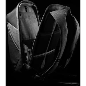 A grey backpack with a sleek design, featuring multiple compartments and a logo on the exterior.