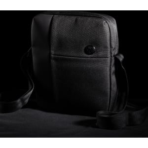 A black shoulder bag featuring a sleek design and a shoulder strap, with a button logo on the front.