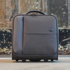 A wheeled underseat luggage in dark grey fabric with a carry handle and a logo.