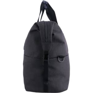 A grey duffle bag with a rounded top, featuring handles and a strap, includes a logo on the front.