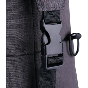A close-up of a dark grey duffle bag featuring a black plastic buckle and strap.