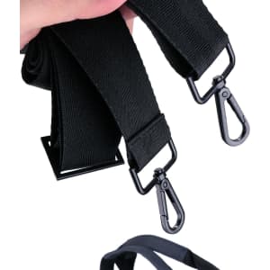 A black duffle bag strap with metal clips and adjustable length. Features a sturdy design.