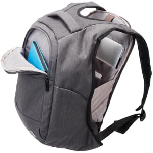 A grey anti-theft backpack with multiple compartments, featuring a laptop sleeve and a carry handle.