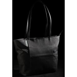 A black tote bag with leather handles and a front pocket, featuring a logo on the side.