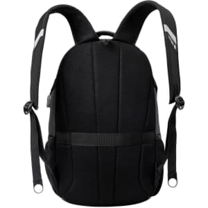 A black backpack with padded shoulder straps and textured fabric, featuring a logo.