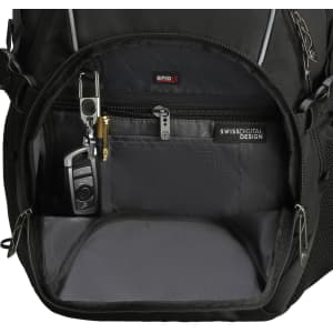 An interior view of a black backpack showing multiple pockets, a keychain, and RFID protection features.