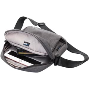 A grey shoulder bag with an open compartment containing a tablet, cards, and an RFID pocket.