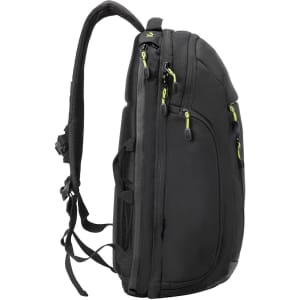A black backpack with green accents, featuring multiple zippers and adjustable straps. It has a side profile view.