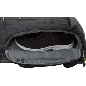 A black Swissdigital Java Backpack with a grey interior, featuring a compartment holding a black sneaker.