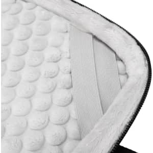 A close-up of the interior padding of a Swissdigital Bolligen 14'' Laptop Sleeve, featuring soft, plush white material.