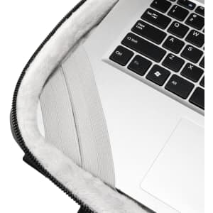 A laptop sleeve with a grey interior, featuring a soft lining and a zipper edge. It has a logo on the exterior.