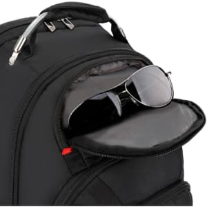 A black backpack featuring a front pocket with sunglasses inside. It has a sleek, modern design and a logo.