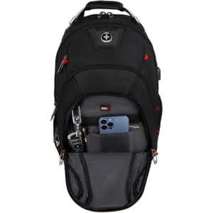 A black Swissdigital Pixel Backpack with multiple compartments and a small blue phone visible inside. The backpack has a logo.
