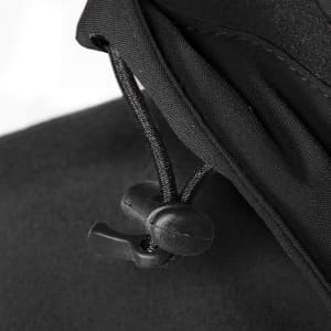 A close-up of the adjustable neck cinch on a black men's jacket, featuring a toggle and drawstring for a snug fit.