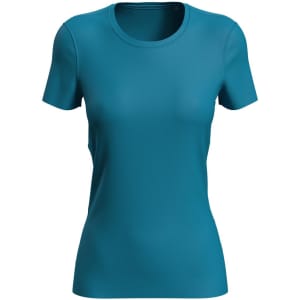 A women's active sports T-shirt in a teal colour, featuring a fitted design and short sleeves. It has a logo.