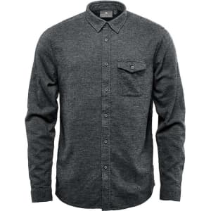 A dark green long sleeve twill shirt with a button-up design and a chest pocket. It features a logo on the collar.