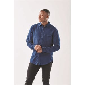 A long sleeve, button-up shirt in navy blue with a pocket and a logo on the chest.