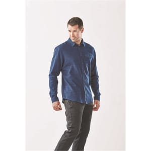 A men's long sleeve twill shirt in navy blue, featuring a button-up front and a logo on the pocket.