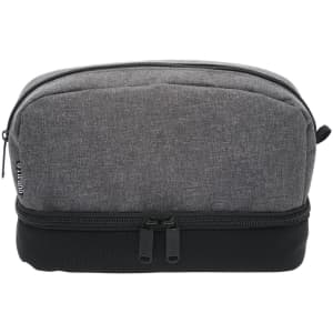A grey and black toiletry bag with a zippered closure and a logo on the side.