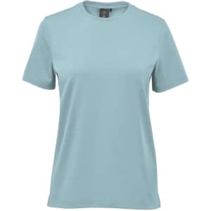 A light blue women's t-shirt with short sleeves and a round neckline. It features a brand logo on the tag.