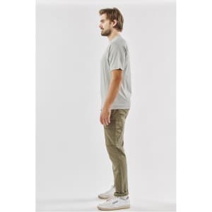 A light grey men's t-shirt displayed on a model, featuring a simple design and a logo.