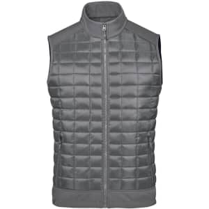 A grey thermal softshell vest featuring a quilted design and a zippered front. It has pockets and a branding logo.