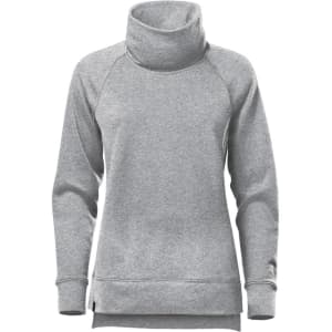 A grey women's cowl neck pullover featuring long sleeves and a relaxed fit. It has a logo on the design.