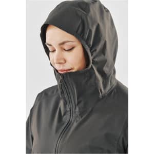 A close-up of a women's rain jacket in dark grey, featuring a hood and a zipped front. The jacket has a logo.