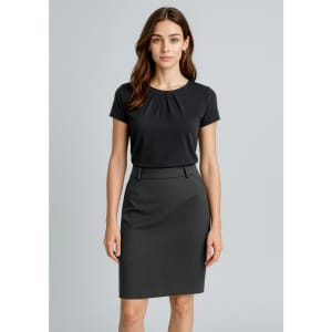 A woman stands wearing a black top and a dark grey pencil skirt. The skirt features a sleek design and a waistband.