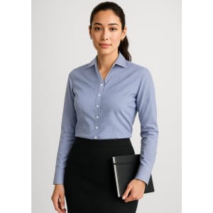A long sleeve, button-up shirt in light blue, featuring a slim fit and a logo. Suitable for formal attire.