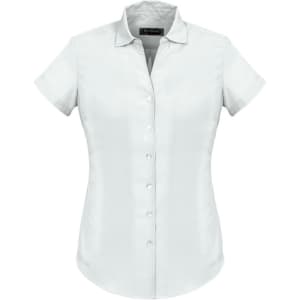 A plain short sleeve shirt in light blue, featuring a button-up front and a collar, with branding displayed.
