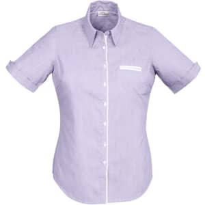 A short-sleeve button-up shirt in light purple with a white chest pocket and rolled cuffs. Features a logo.