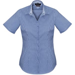 A short sleeve, button-up women's shirt featuring a blue and white checkered pattern and a logo.
